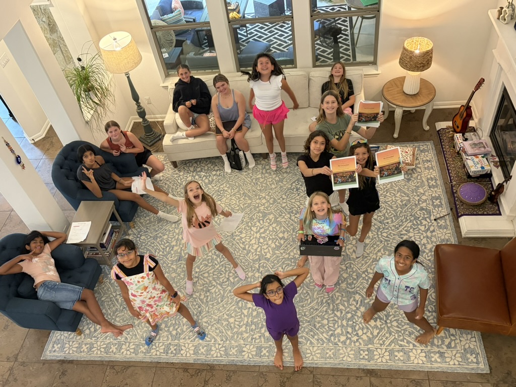 Fifteen girls at AI Like a Girl Explorers Camp, holding certificates and projects